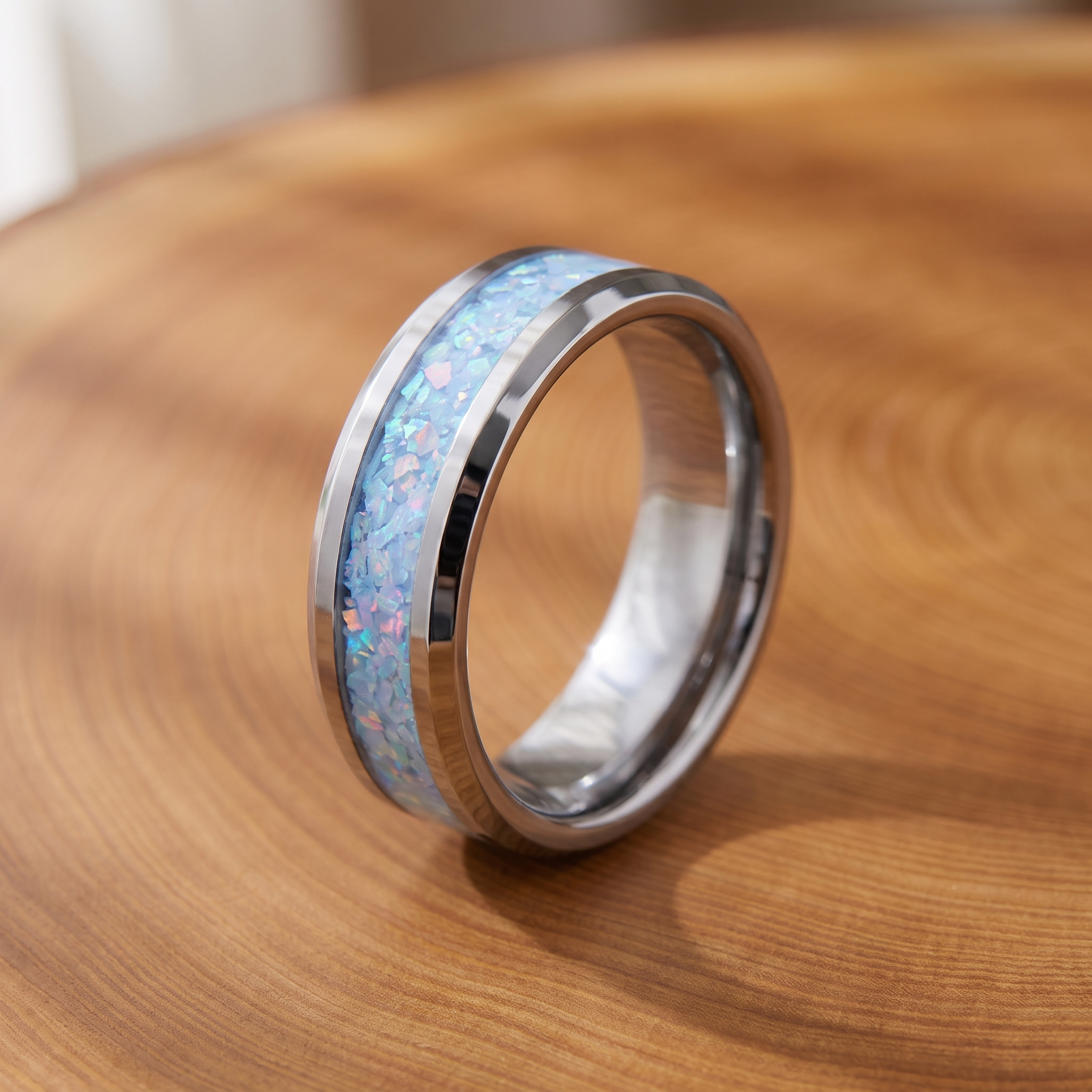 Blue opal inlay steel band ring on a tree-trunk slab