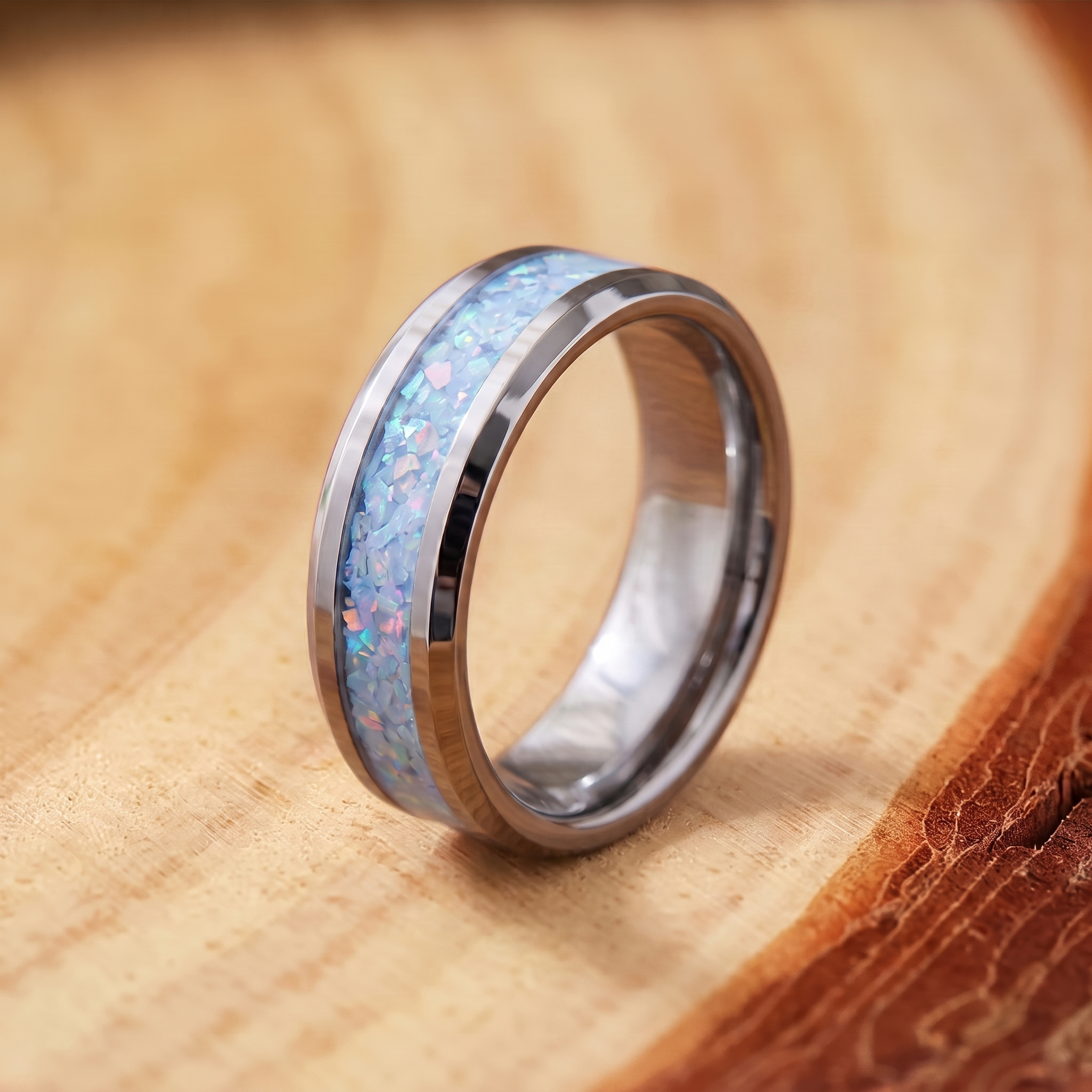 Blue Opal Inlay Steel Band Ring on a tree-trunk slab