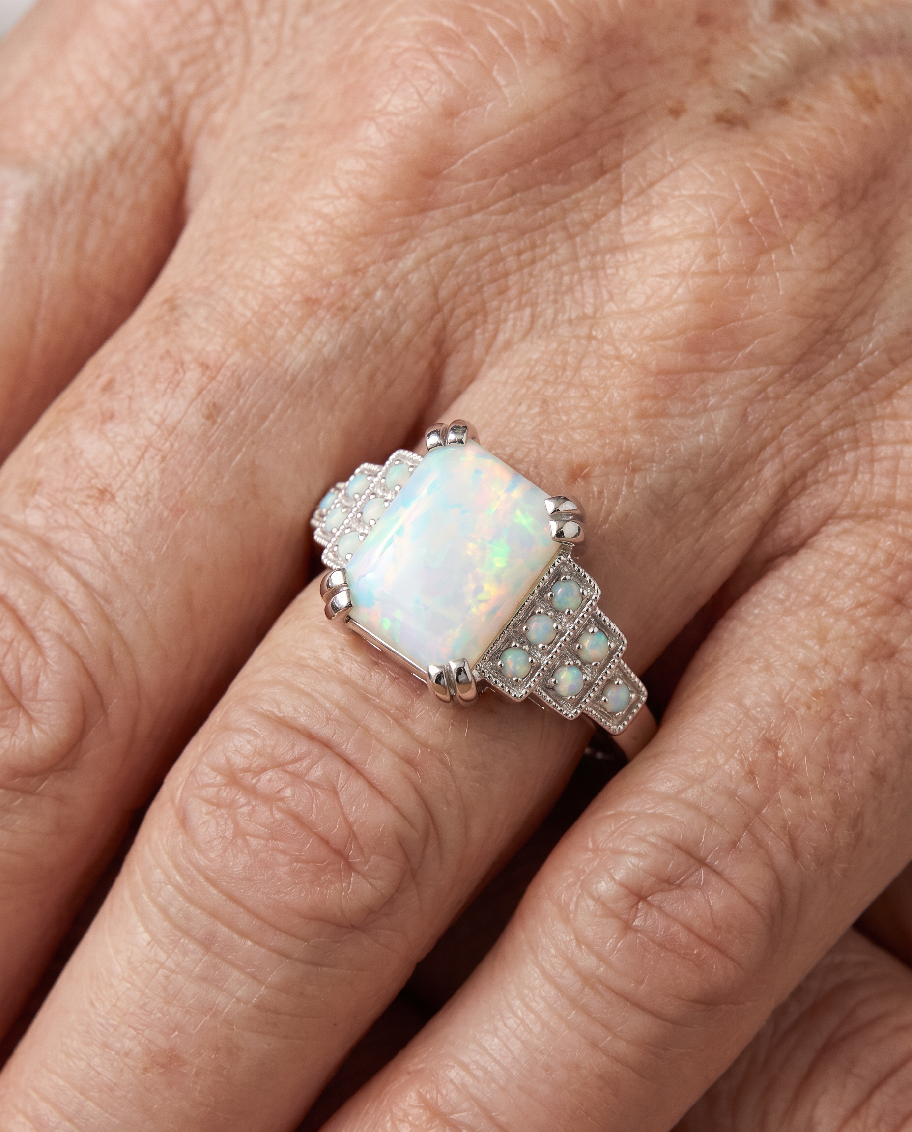 White Opal Art Deco Silver Ring worn on a model
