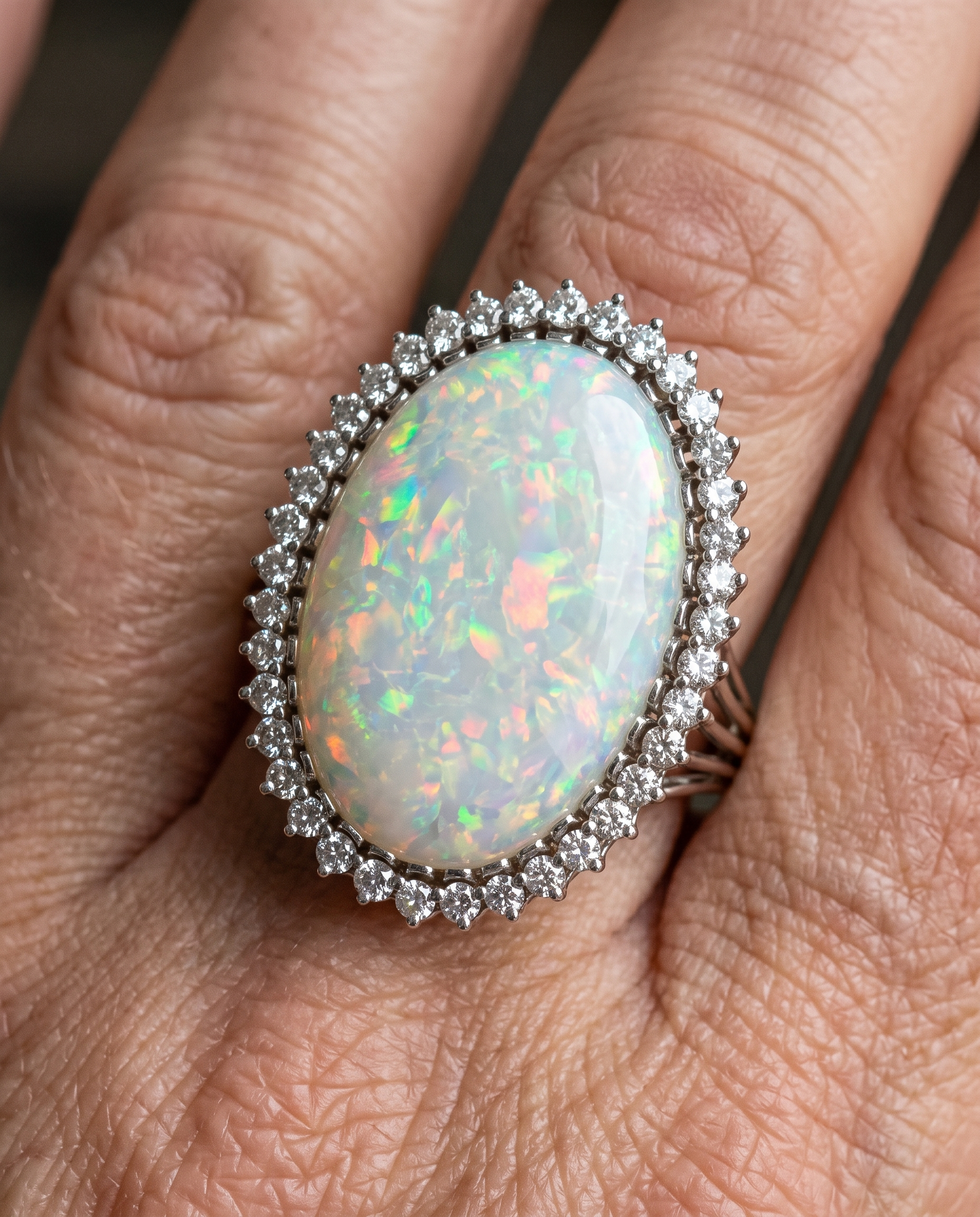 Grand White Opal Halo Ring worn on a model