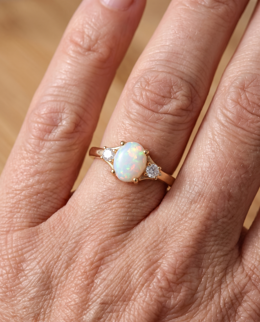 White Opal Three-Stone Gold Ring worn on a model