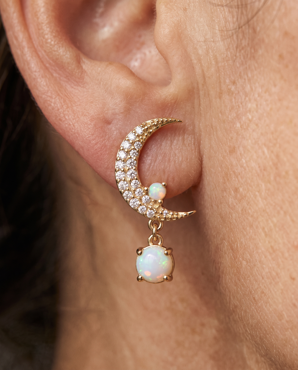 Opal Moon and Star Mismatched Earrings worn on a model