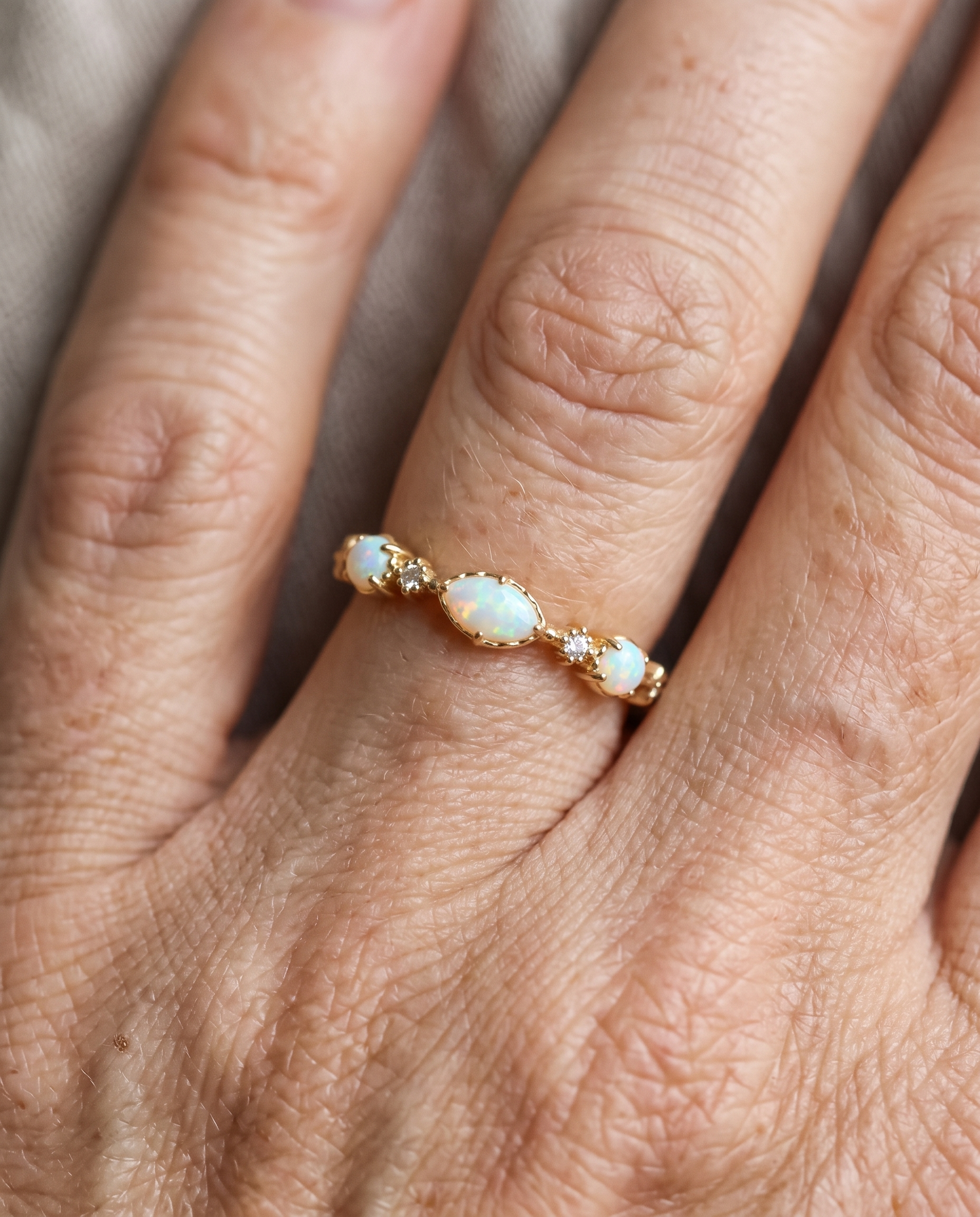 White Opal Marquise Gold Ring worn on a model