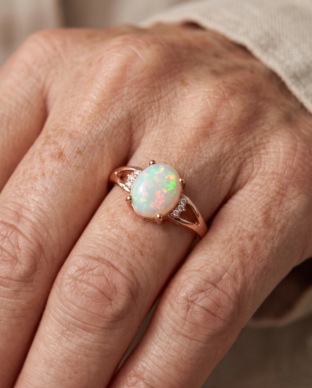 White Opal Rose Gold Ring worn on a model